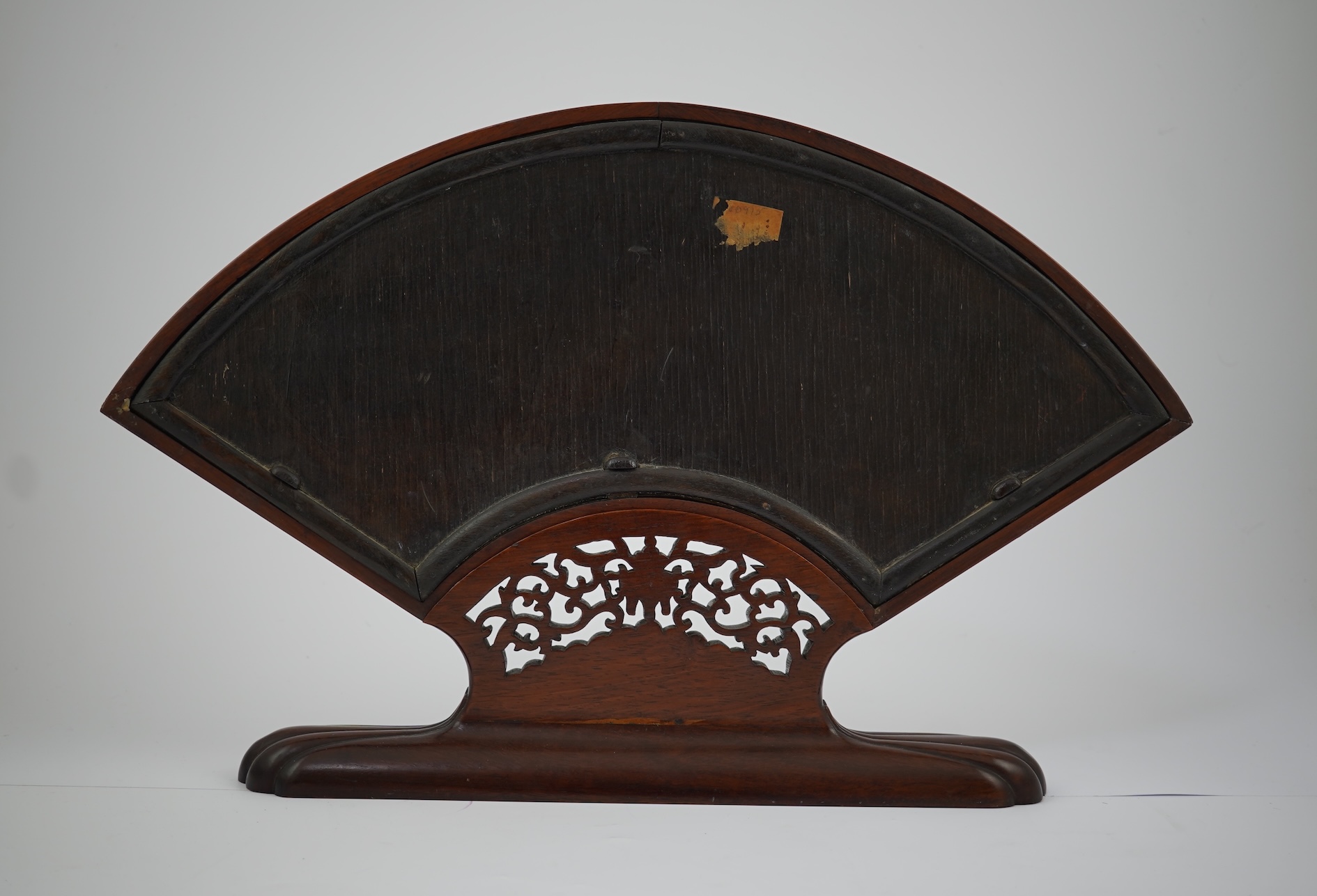 A Chinese painted leaf fan and hardwood stand, late 19th century